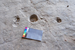 Small grinding holes can occasionally be found in the floors