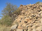 Remains of a once formidable perimeter wall surround the peak