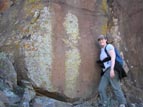 Several petroglyph panels grace the caprock wall below the ruin