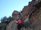 A thirty-foot caprock wall surrounds the summit